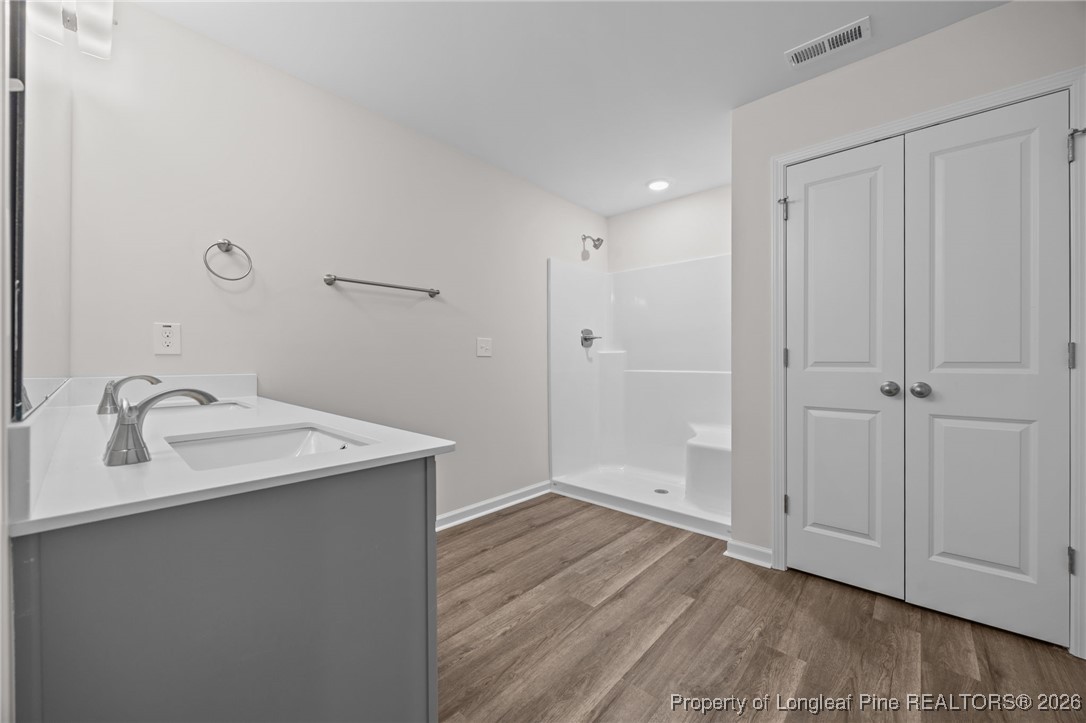 96 Regis Lane Coats, NC 27521 - Photo 27 of 36 a bathroom with a sink and a mirror