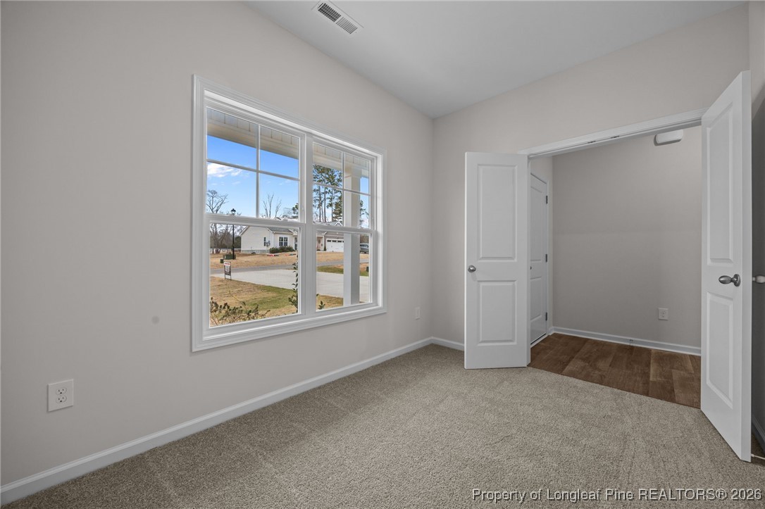 96 Regis Lane Coats, NC 27521 - Photo 5 of 36 an empty room with windows and closet