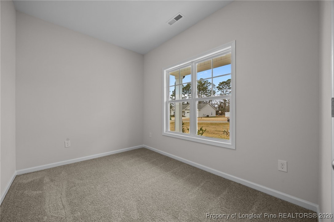 96 Regis Lane Coats, NC 27521 - Photo 6 of 36 an empty room with windows