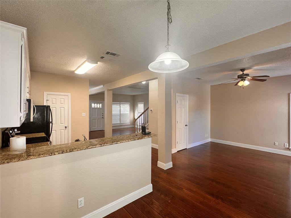 9435 Blue Jay Way Irving, TX 75063 - Photo 12 of 27 a view of a living room a hallway and wooden floor