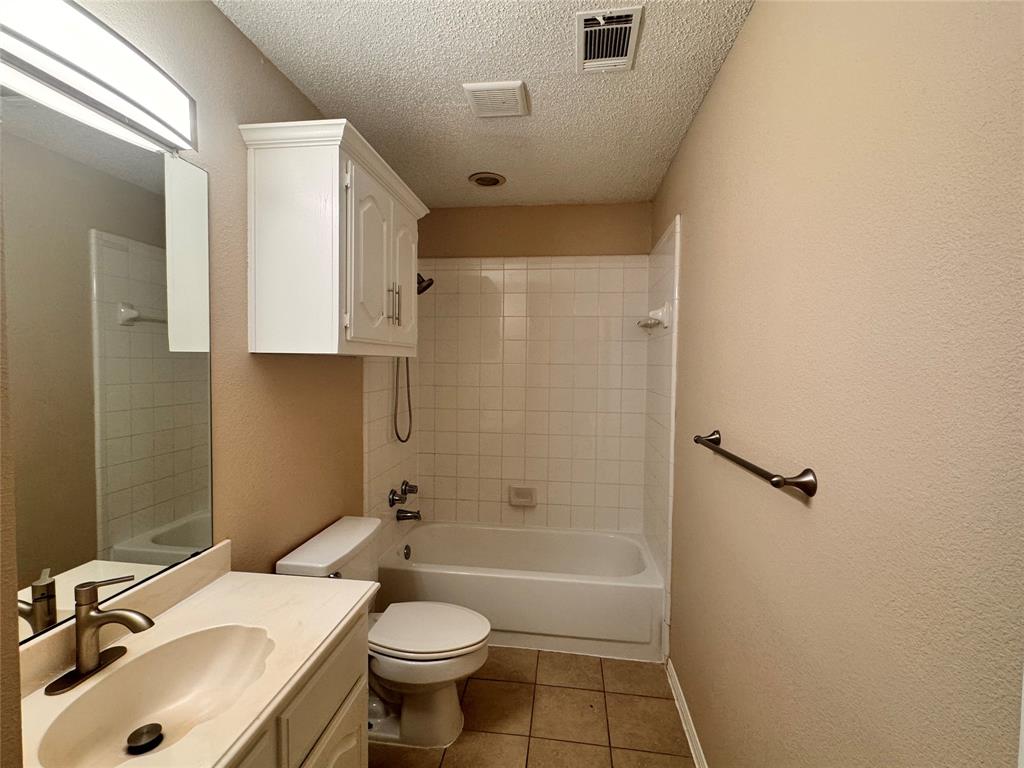 9435 Blue Jay Way Irving, TX 75063 - Photo 27 of 27 a bathroom with a sink toilet and shower
