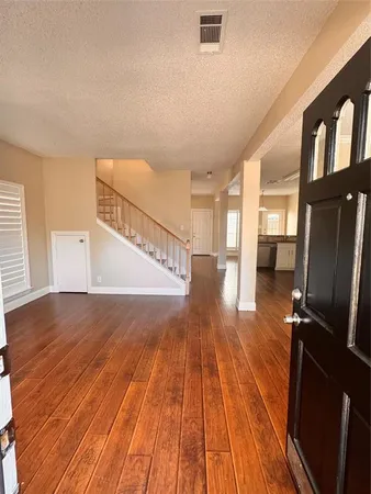 a view of entryway with wooden floor