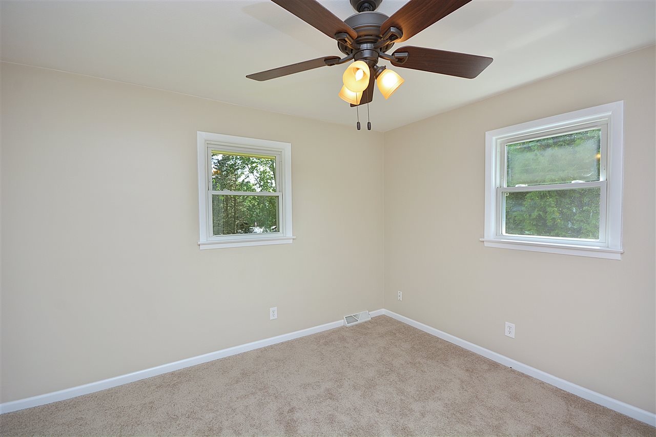5181 Welsh Road Rockford, IL 61107 - Photo 17 of 24 an empty room with a window and a fan