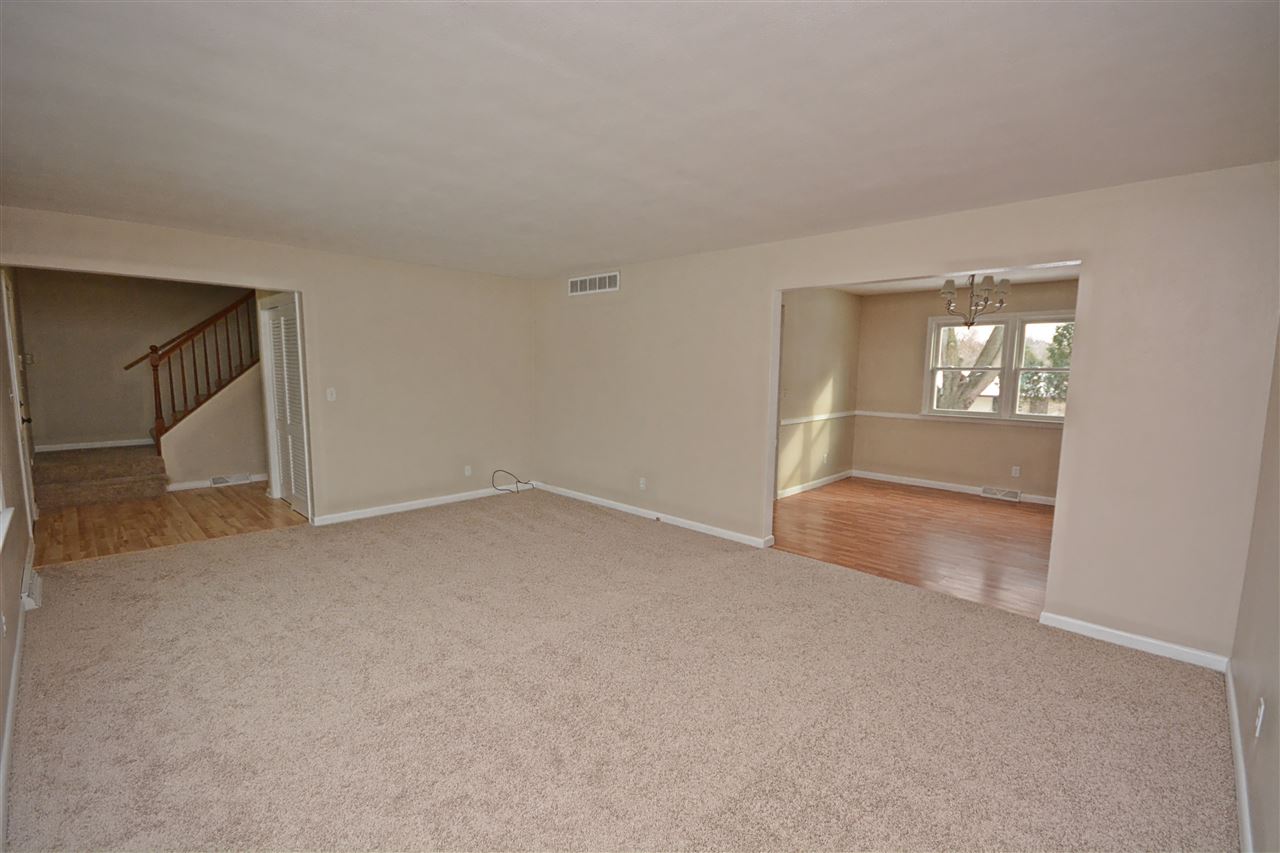 5181 Welsh Road Rockford, IL 61107 - Photo 3 of 24 an empty room with an empty space and windows