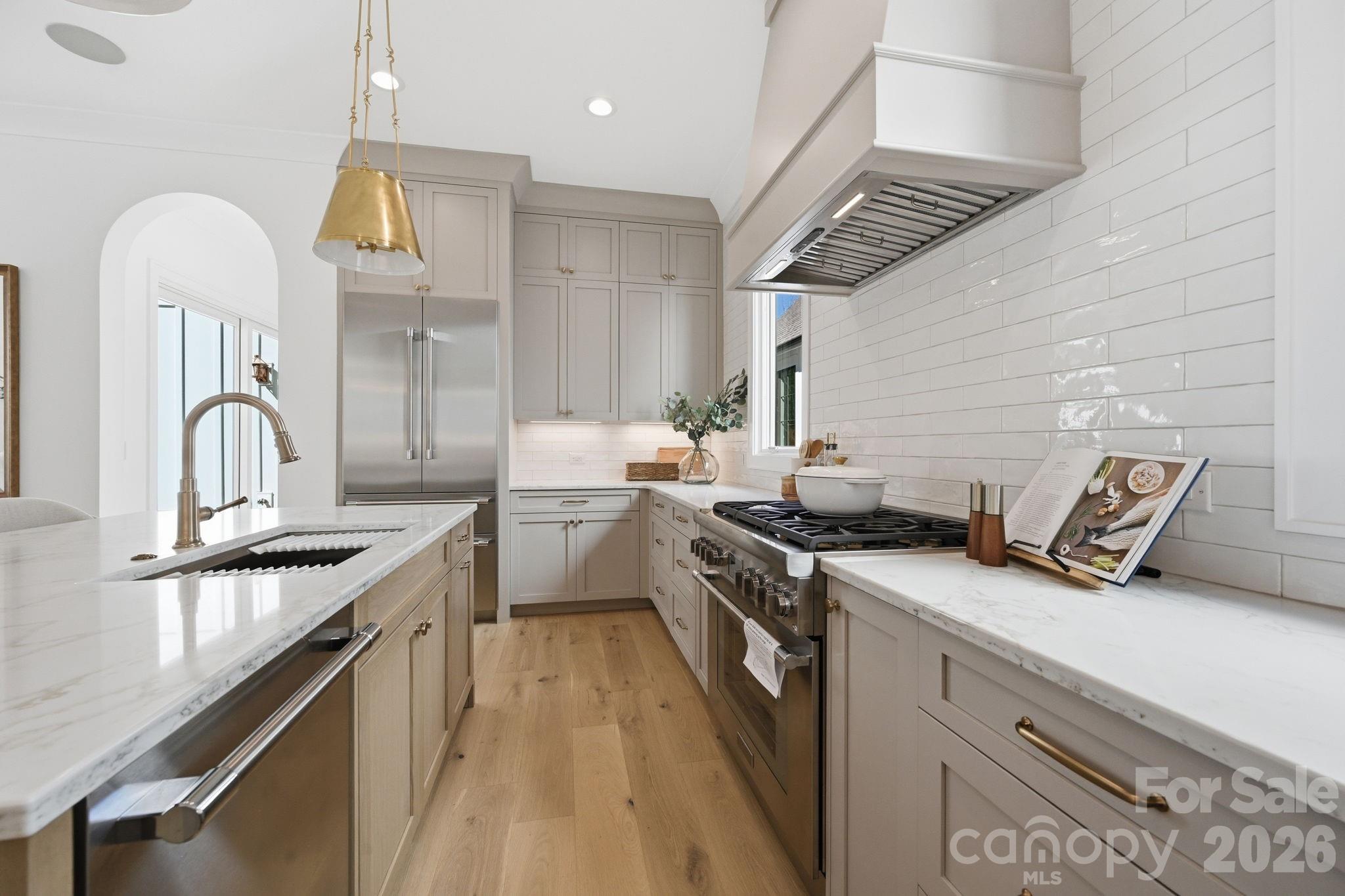610 Walnut Street Davidson, NC 28036 - Photo 13 of 33 a kitchen with a sink appliances and cabinets