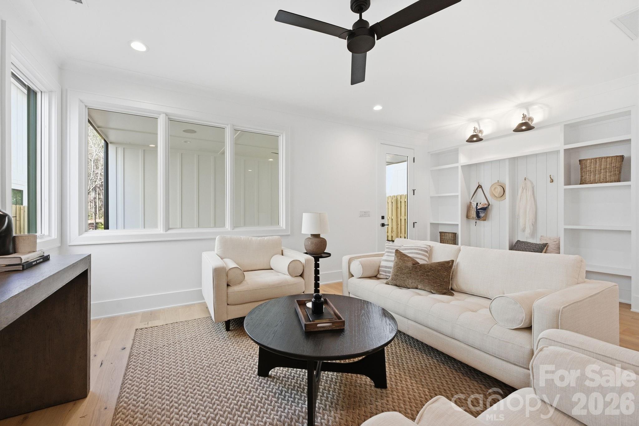 610 Walnut Street Davidson, NC 28036 - Photo 26 of 33 a living room with furniture and a potted plant