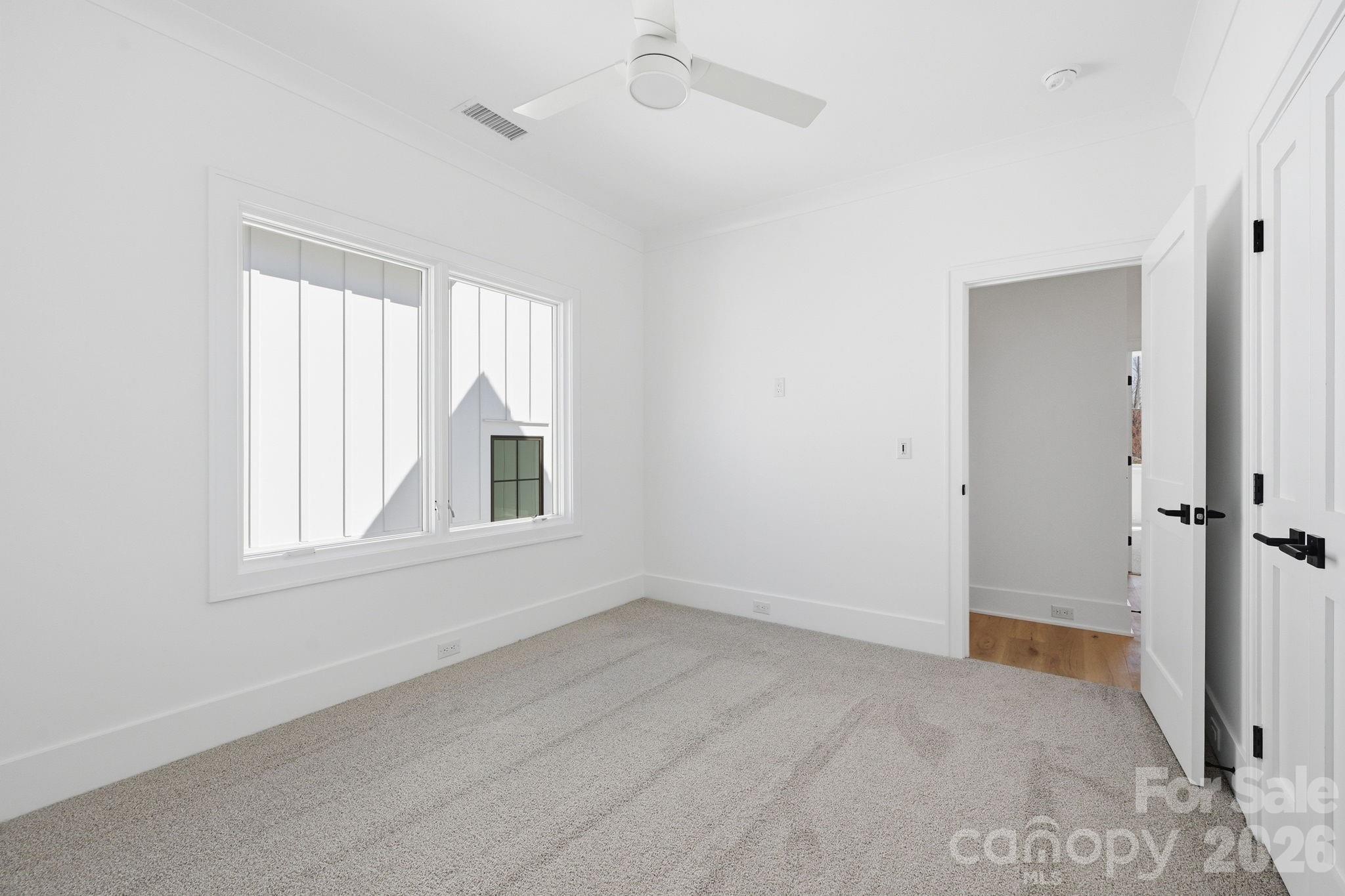 610 Walnut Street Davidson, NC 28036 - Photo 28 of 33 an empty room with windows and closet
