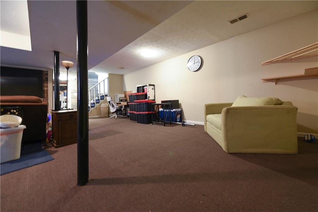 3280 Devilla Trace College Park, GA 30349 - Photo 13 of 21 a living room with furniture and a flat screen tv