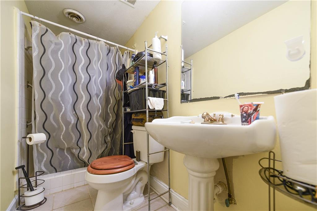 3280 Devilla Trace College Park, GA 30349 - Photo 17 of 21 a bathroom with a sink and a toilet