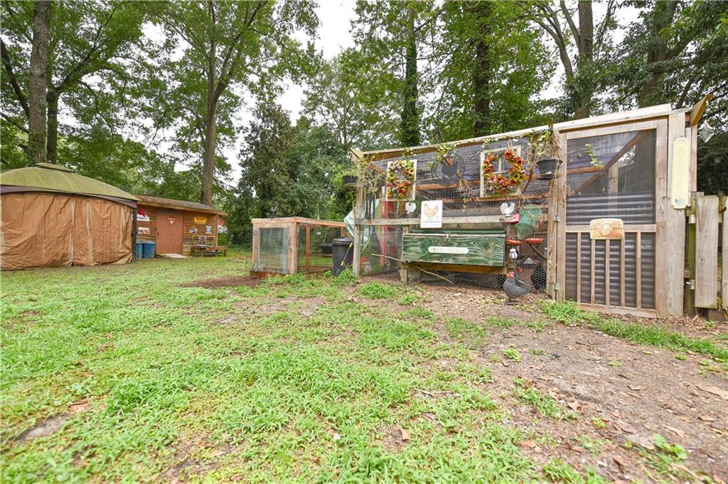 3280 Devilla Trace College Park, GA 30349 - Photo 19 of 21 front view of a house with a yard