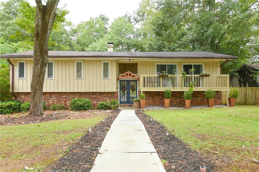3280 Devilla Trace College Park, GA 30349 - Photo 20 of 21 a front view of a house with garden