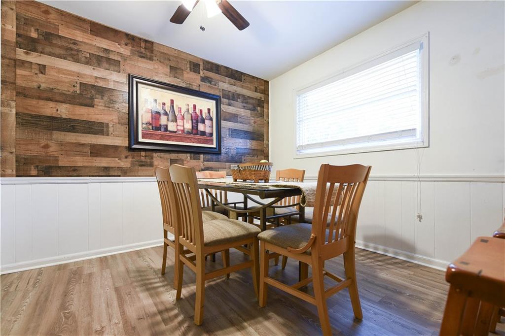 3280 Devilla Trace College Park, GA 30349 - Photo 3 of 21 a view of a dining room with furniture and wooden floor