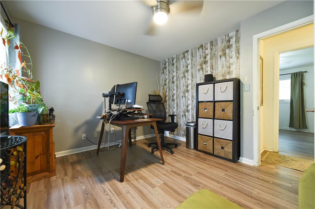 3280 Devilla Trace College Park, GA 30349 - Photo 5 of 21 a view of a workspace with furniture and wooden floor