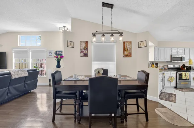 a view of a dining room with furniture