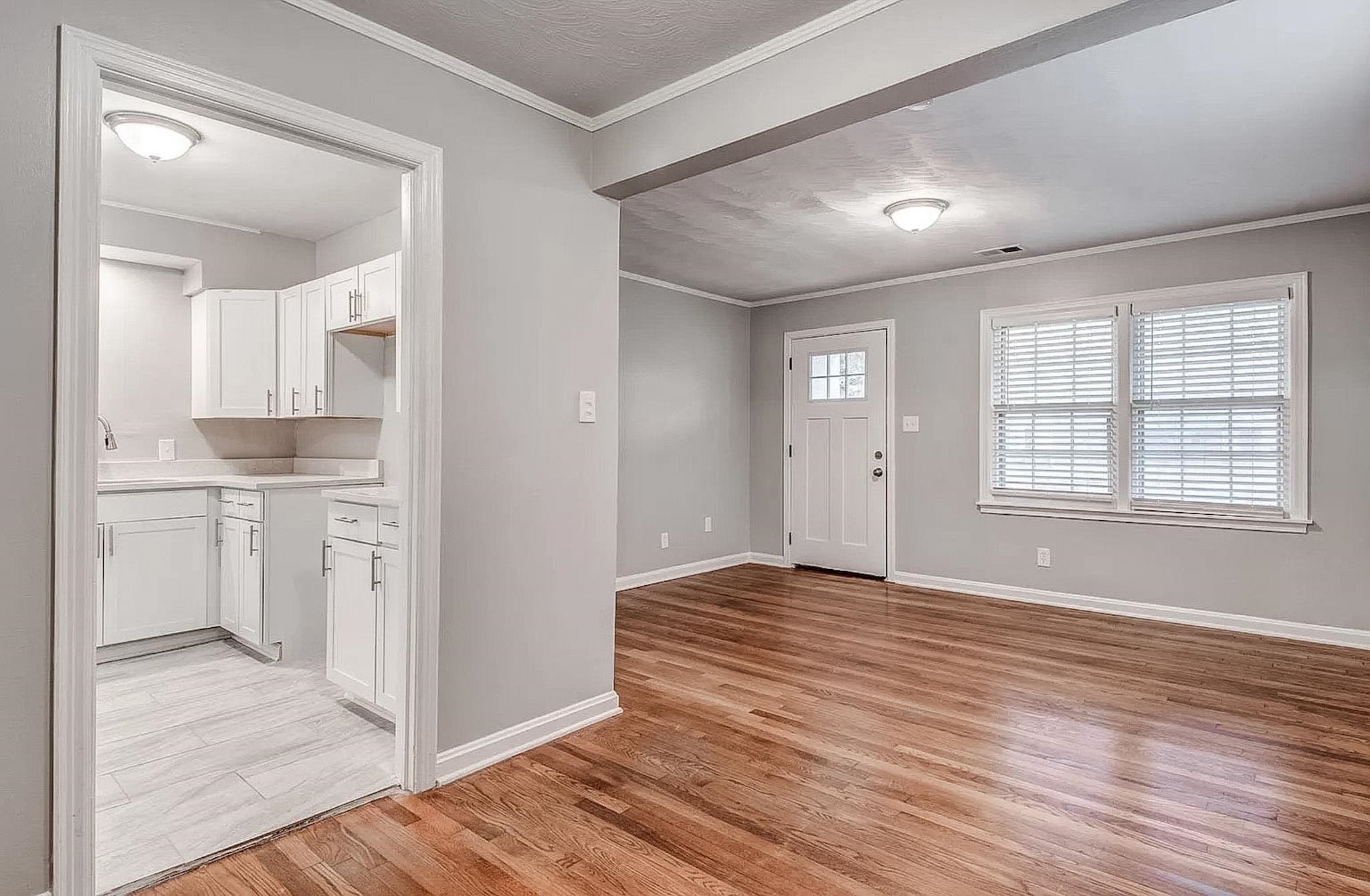 4402 Boyce Road Memphis, TN 38117 - Photo 4 of 13 a view of a kitchen with wooden floor and a kitchen