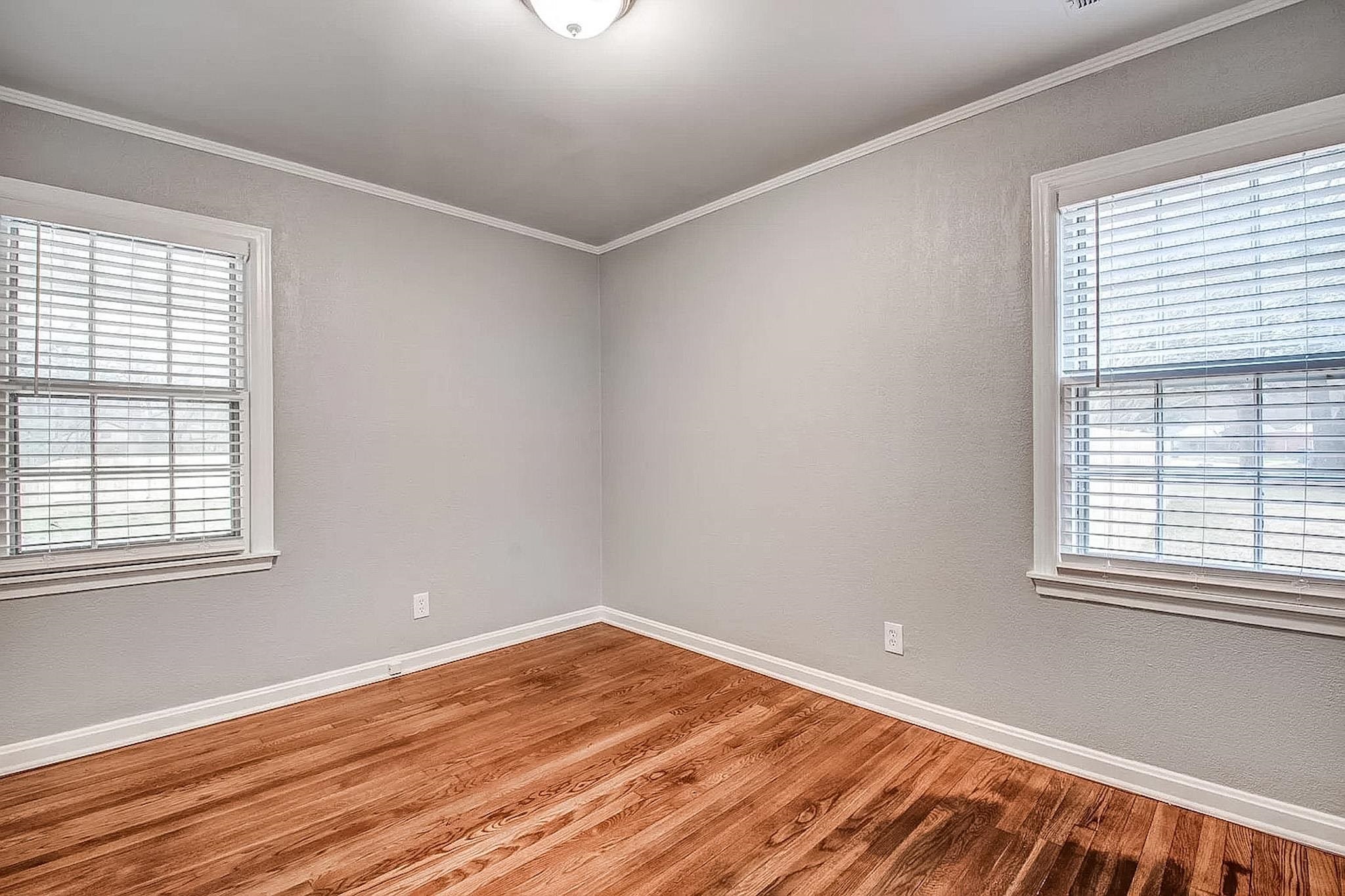 4402 Boyce Road Memphis, TN 38117 - Photo 7 of 13 a view of a room with wooden floor and windows