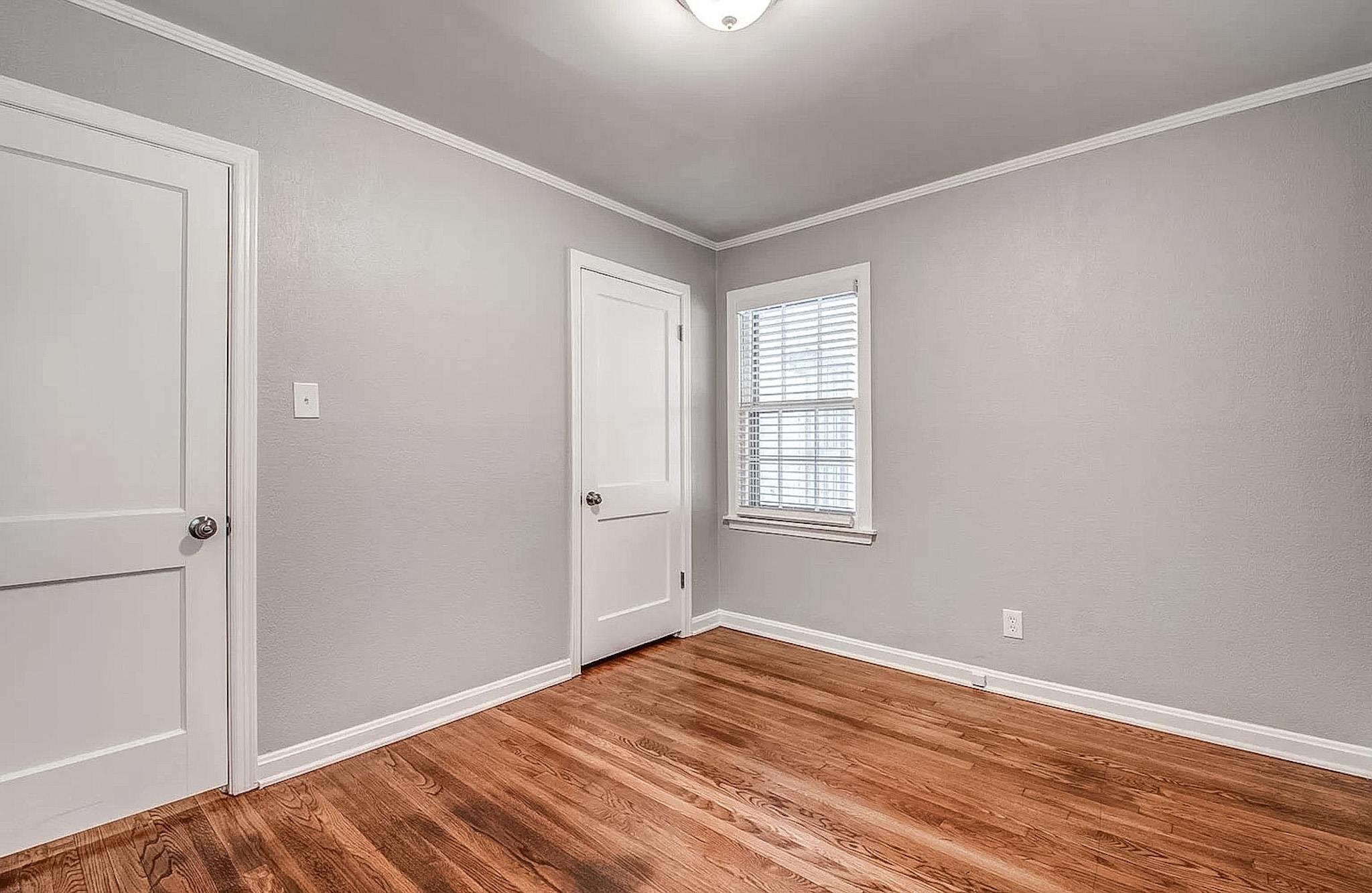 4402 Boyce Road Memphis, TN 38117 - Photo 8 of 13 a view of empty room with wooden floor and fan