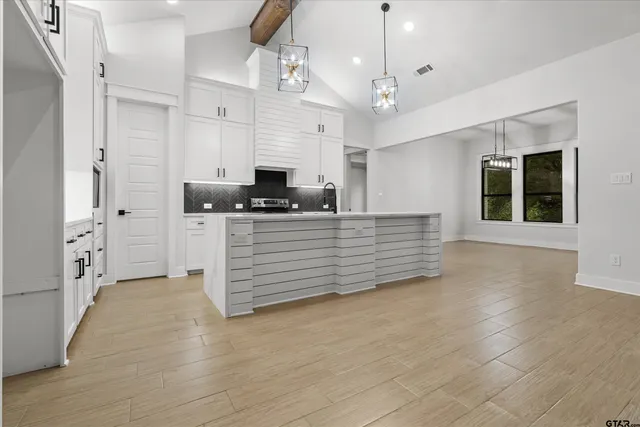 a view of an empty room with windows