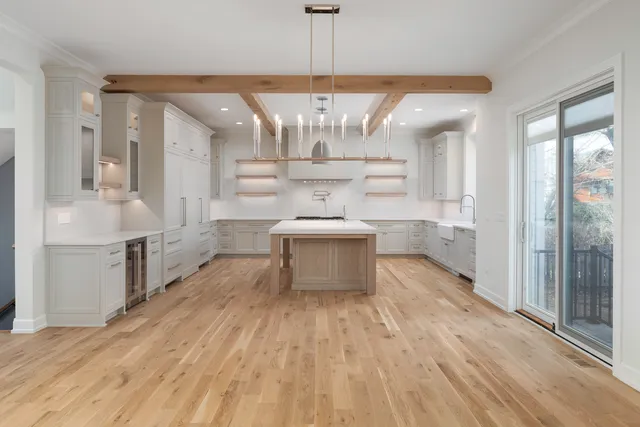 a view of empty room with a flat screen tv and a fireplace