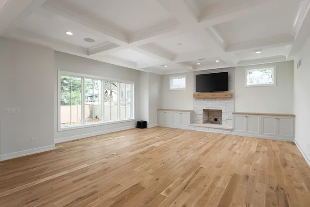 a view of a livingroom with an empty space and a fireplace