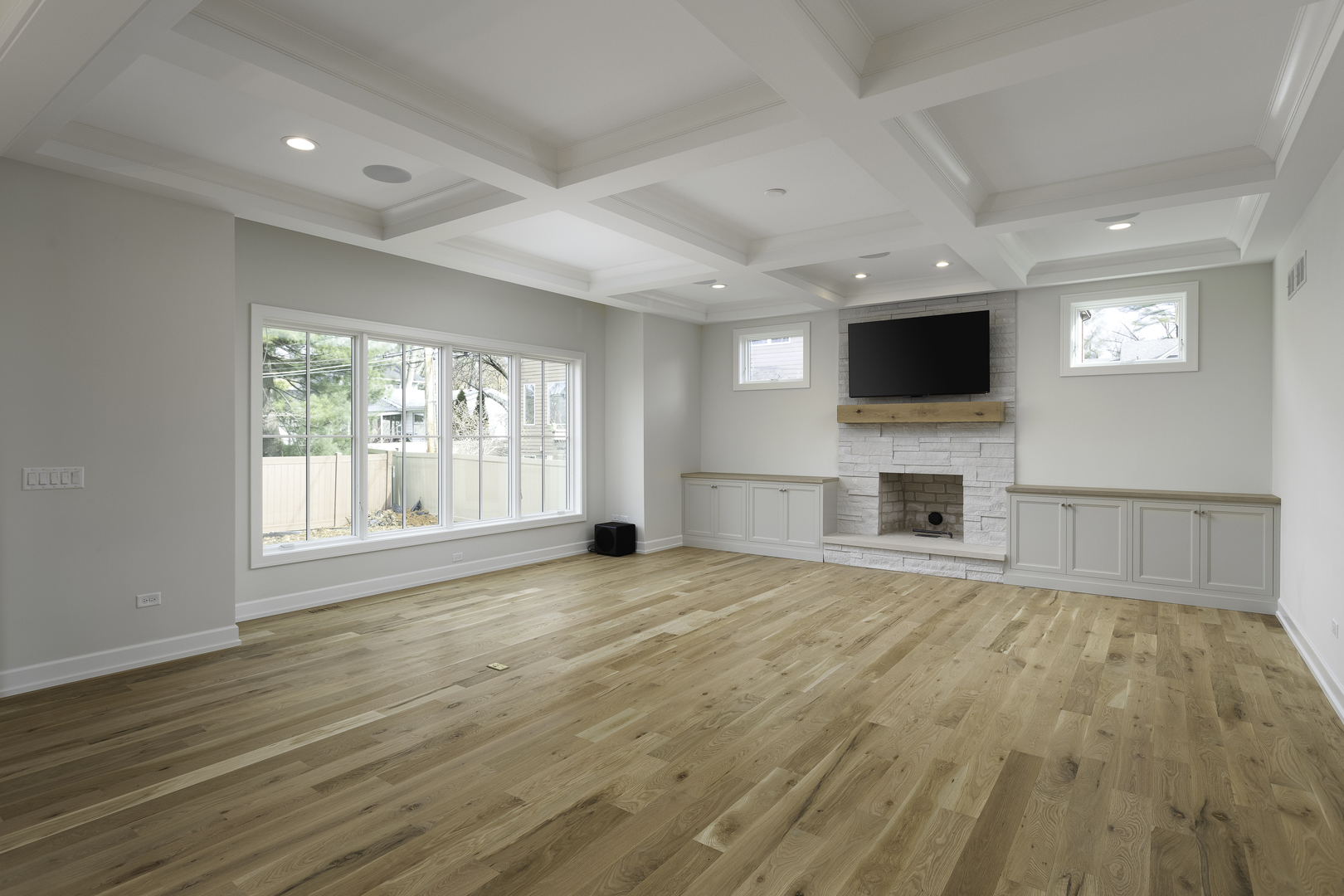 845 Tulip Lane Naperville, IL 60540 - Photo 14 of 40 a view of empty room with a flat screen tv and a fireplace