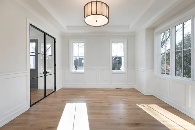 a view of a room with wooden floor and balcony