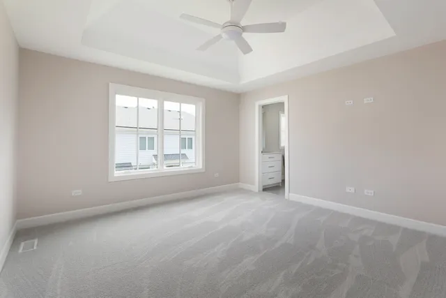 a bathroom with a sink a toilet and a window