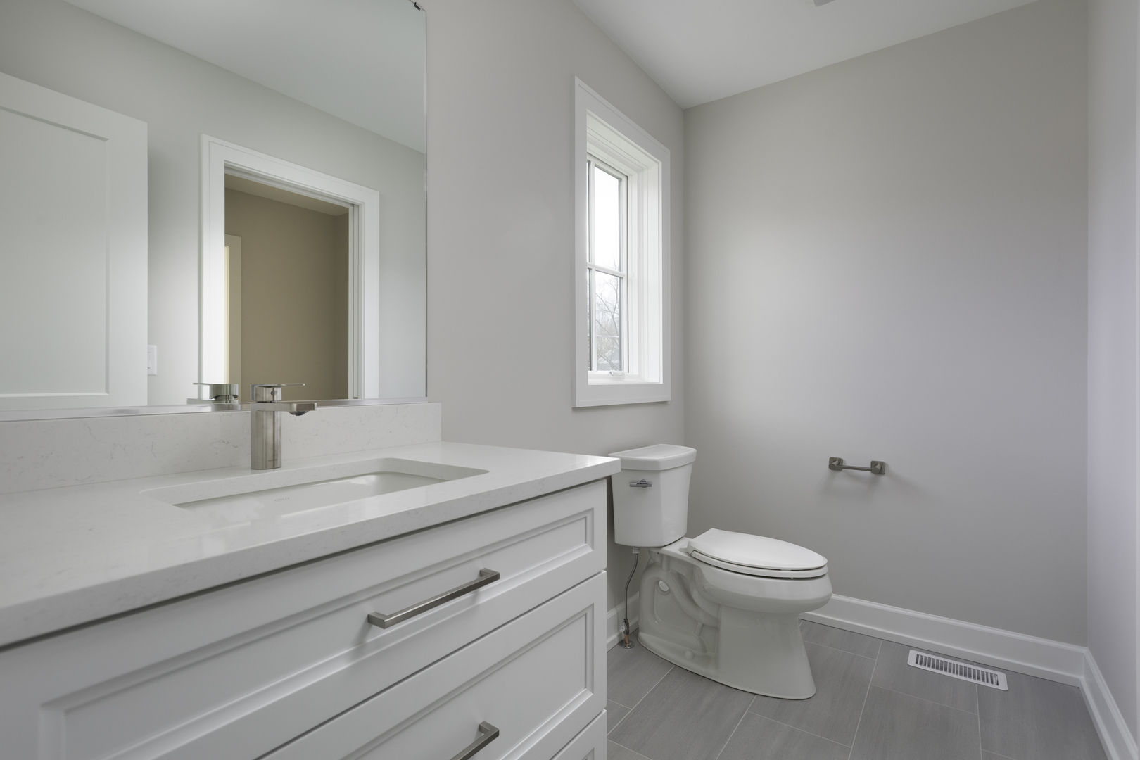 845 Tulip Lane Naperville, IL 60540 - Photo 28 of 40 a bathroom with a sink a toilet and a window