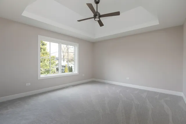 a living room with furniture a window and a flat screen tv