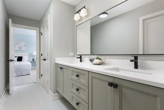 a view of an empty room with chandelier and window