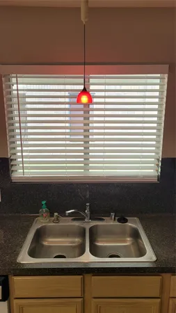 a kitchen sink with a window