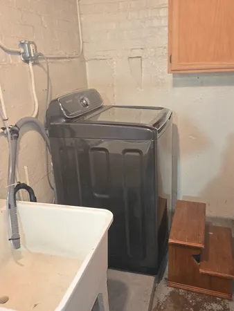 a bathroom with a sink a toilet and mirror