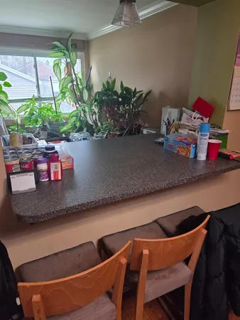 a kitchen with a table and chairs in it