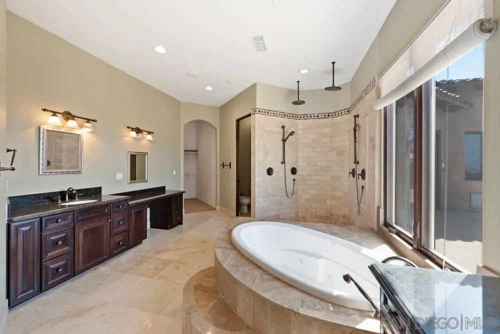 18121 El Brazo Rancho Santa Fe, CA 92067 - Photo 14 of 25 a bathroom with a granite countertop sink toilet and shower