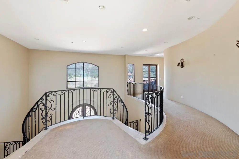 18121 El Brazo Rancho Santa Fe, CA 92067 - Photo 20 of 25 a view of a hallway with windows
