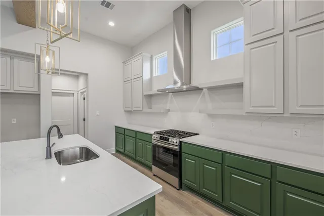 a bathroom with a sink a mirror a toilet and a window