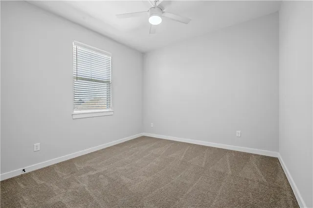 a en suite bathroom with double sink and a mirror