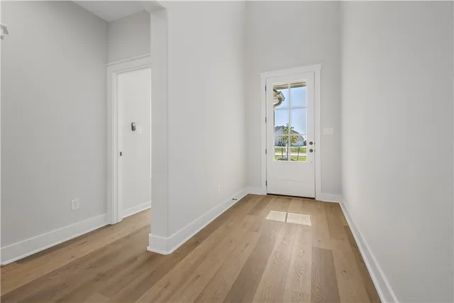 a view of kitchen with cabinets and wooden floor