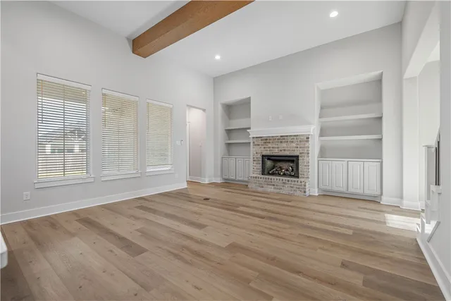 a kitchen with a sink a stove and cabinets