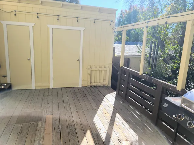 a view of a balcony with wooden floor