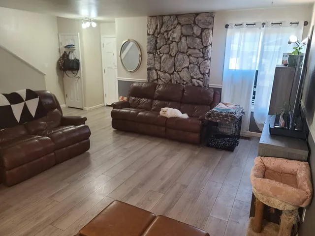 a living room with furniture and a flat screen tv