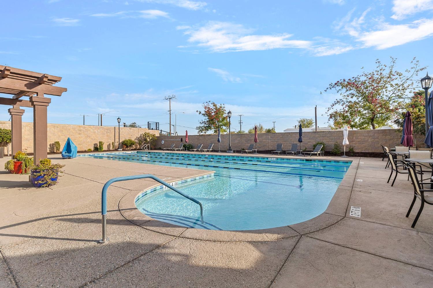 7525 Eldred Way Sacramento, CA 95829 - Photo 31 of 38 community pool with a patio area and a pergola