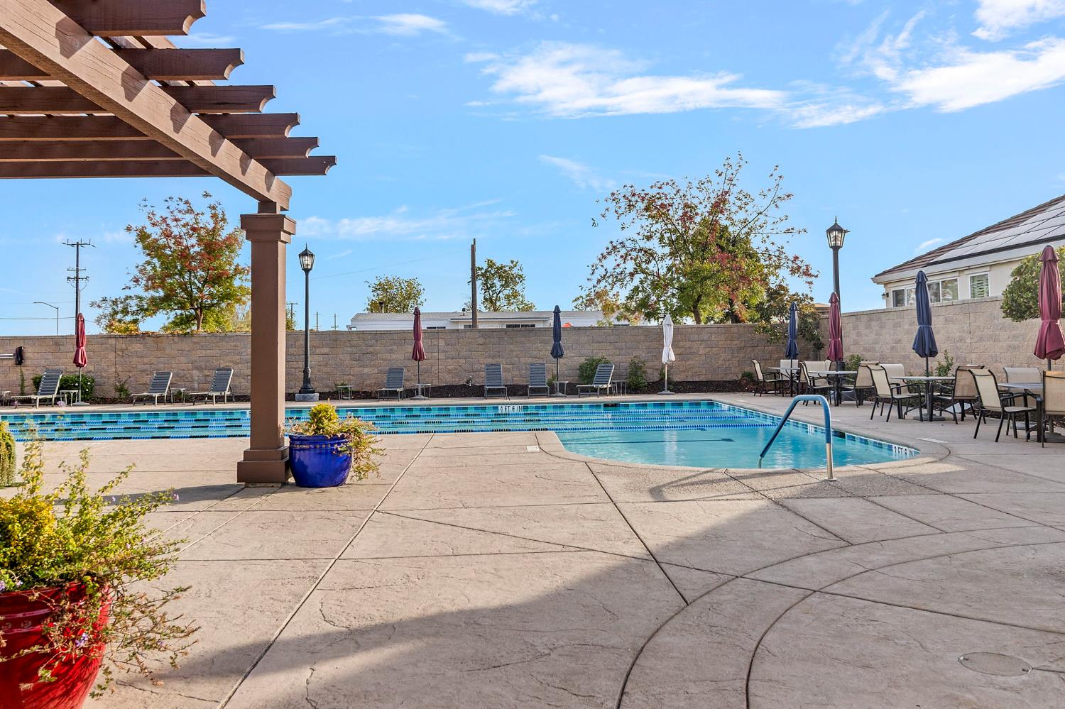 7525 Eldred Way Sacramento, CA 95829 - Photo 33 of 38 community pool with a patio area, a fenced backyard, and a pergola