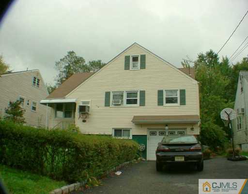 70 Brandywine Road Fords, NJ 08863 - Photo 1 of 2 a car parked in front of a white house