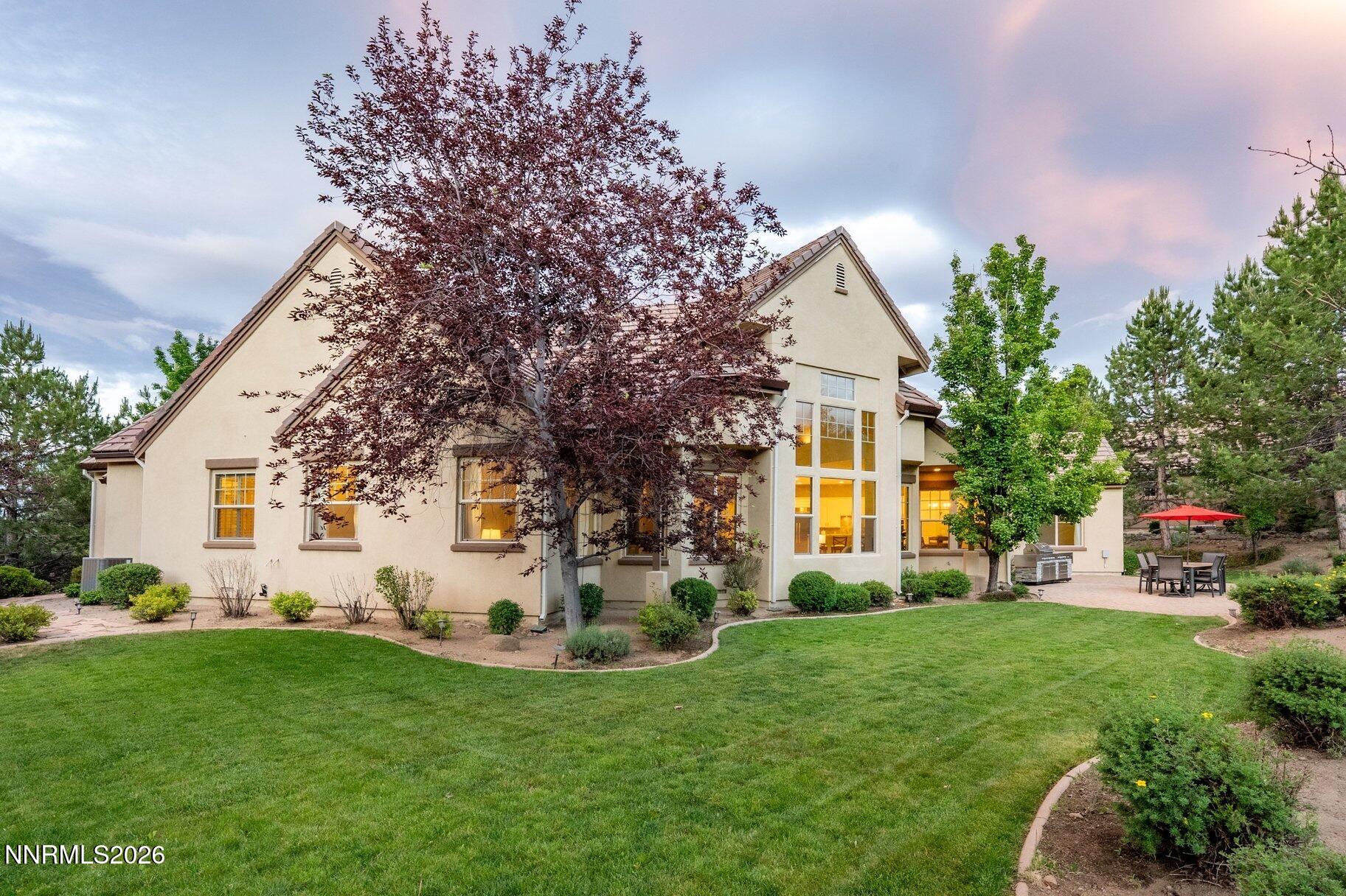 16925 Rue Du Parc Reno, NV 89511 - Photo 2 of 34 a front view of a house with garden