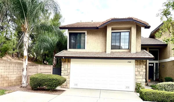 a front view of a house with a garage