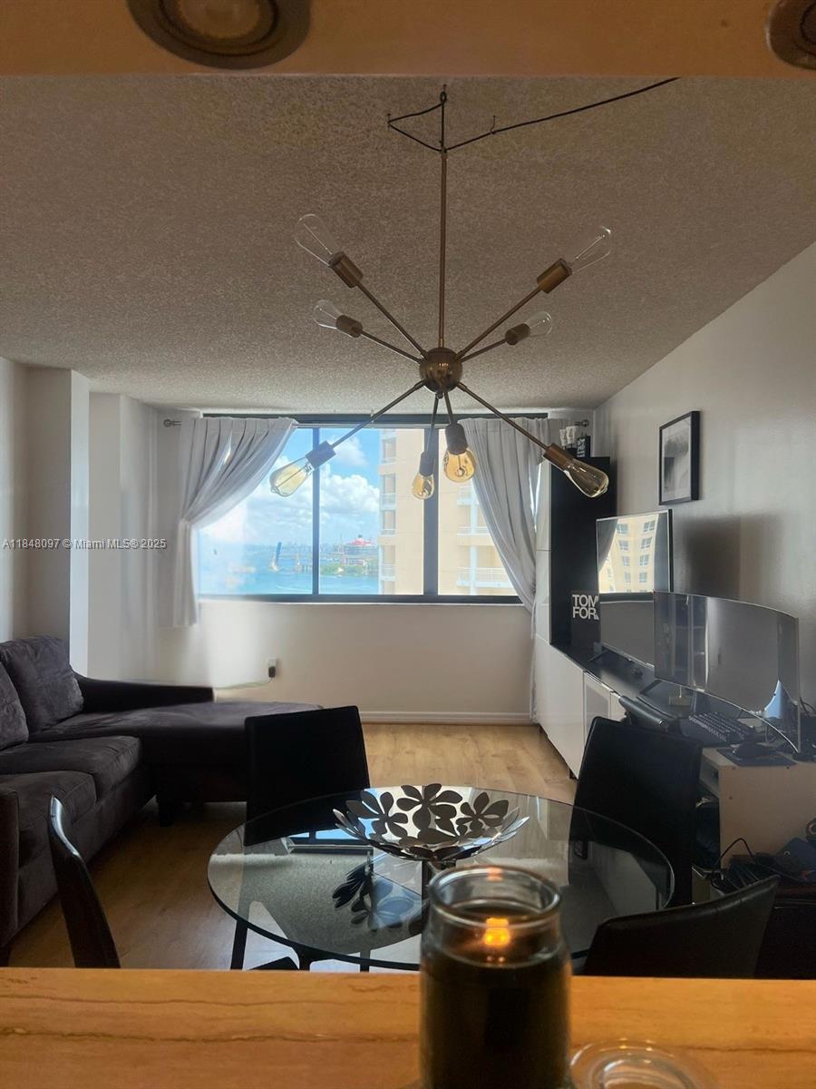 540 Brickell Key Drive, Unit 1524 Miami, FL 33131 - Photo 3 of 44 a living room with furniture and a window