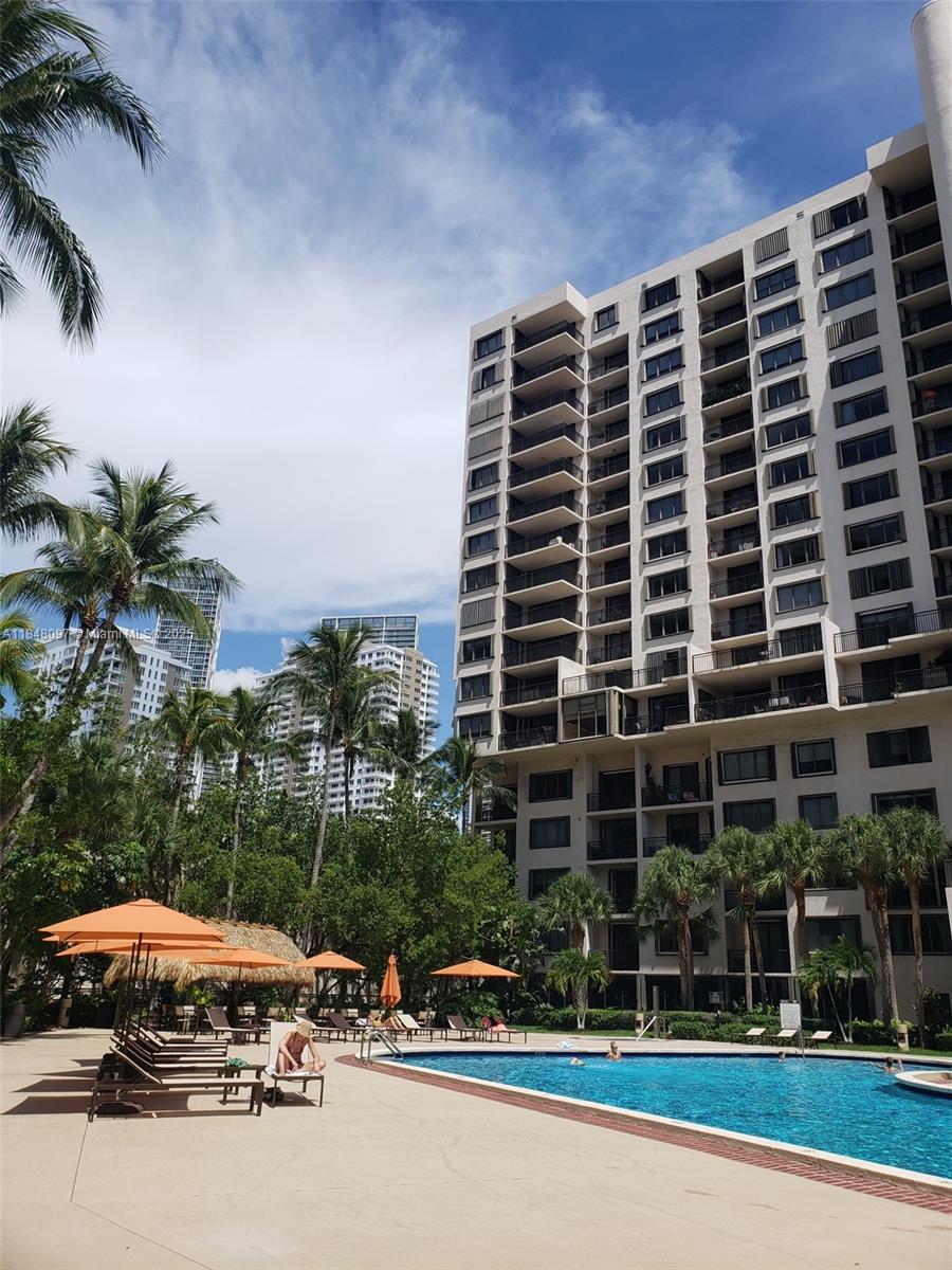 540 Brickell Key Drive, Unit 1524 Miami, FL 33131 - Photo 34 of 44 a front view of a building with plants
