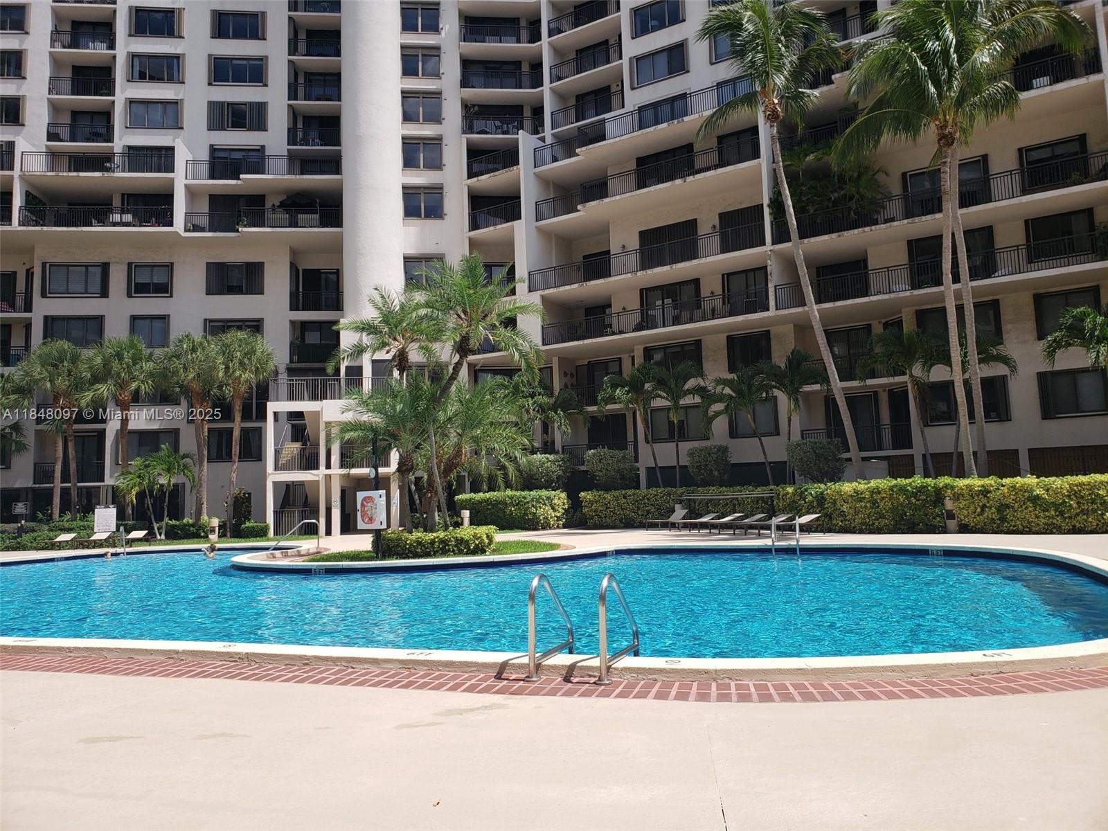 540 Brickell Key Drive, Unit 1524 Miami, FL 33131 - Photo 35 of 44 a view of building with yard and large trees