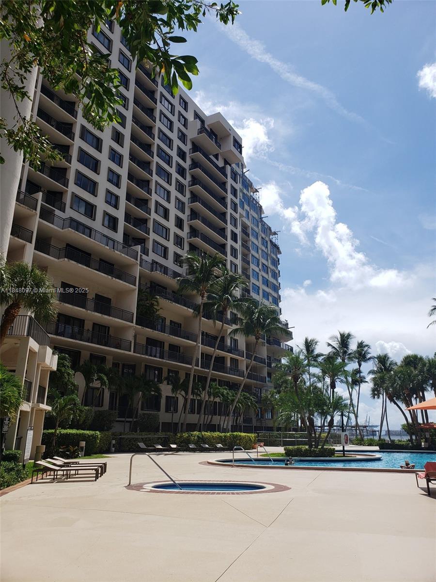 540 Brickell Key Drive, Unit 1524 Miami, FL 33131 - Photo 37 of 44 a view of a street with a building in the background